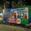 Banner Dicopot Picu Emosi, Tuntutan Dialog Menguat di Tengah Polemik Jalan Tembus