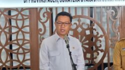 Menko PMK Sugiono saat menyampaikan laporan progres rehabilitasi dan rekonstruksi pascabencana Sumatera di Jakarta.